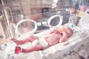 baby in incubator NICU