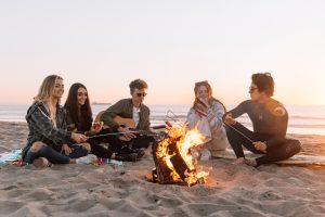 People sitting around a campfire