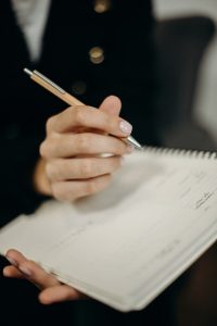 A person takes notes.